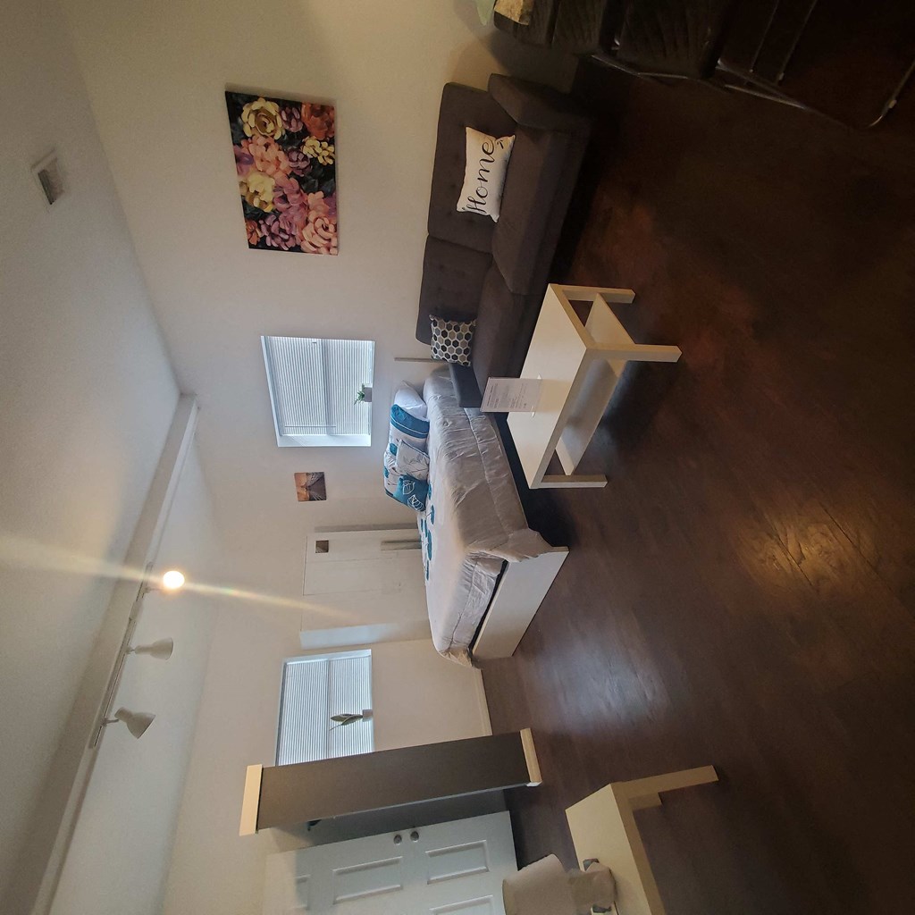 an aerial view of a room with boxes on the floor