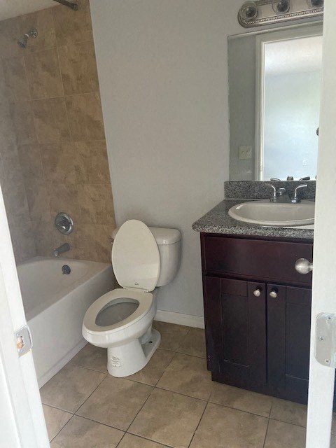 a bathroom with a toilet and a sink and a bath tub