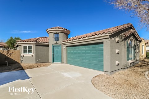 a single story home with a green garage door