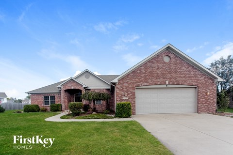 a brick house with a white garage door