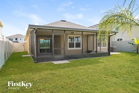 a home with a patio and a grass yard