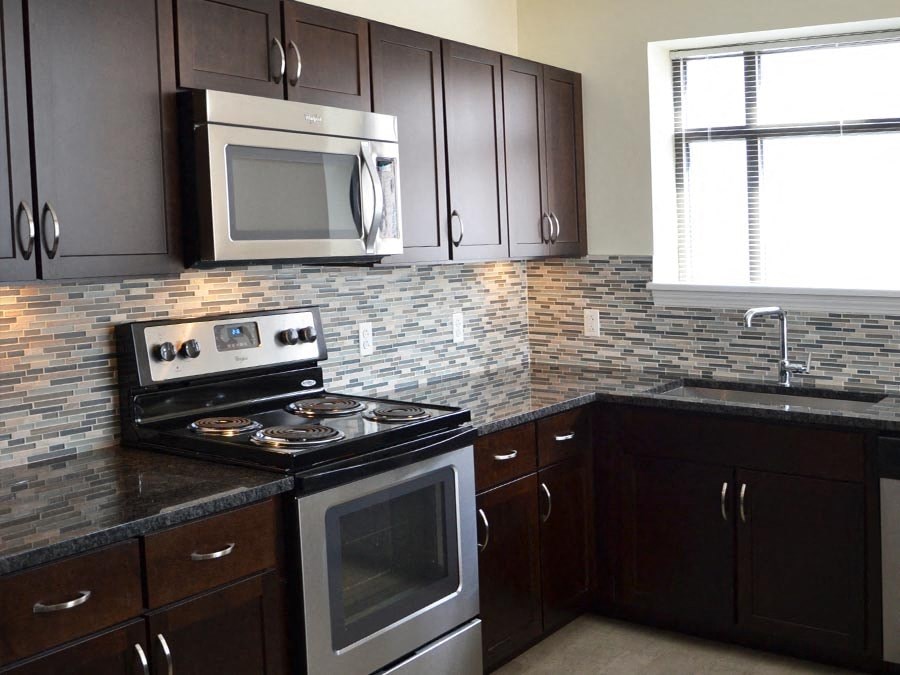 a kitchen with a stove and a microwave