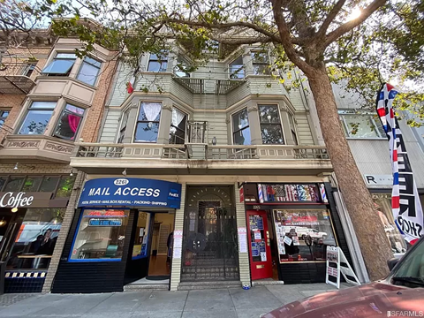 a building with a blue sign in front of it