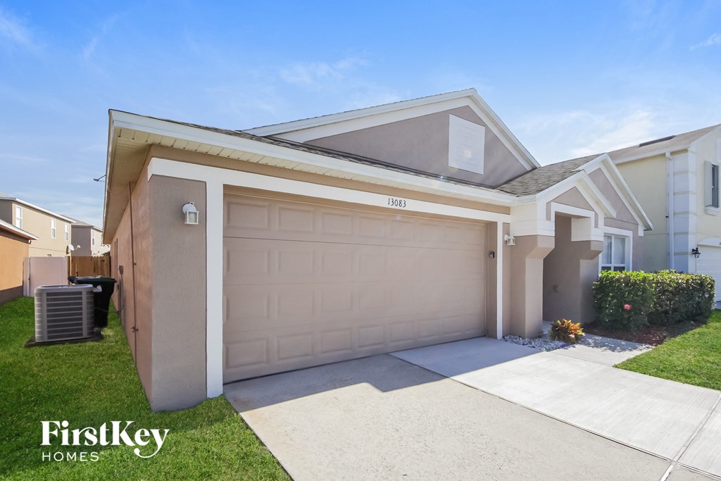 A modern house with a garage and a driveway.