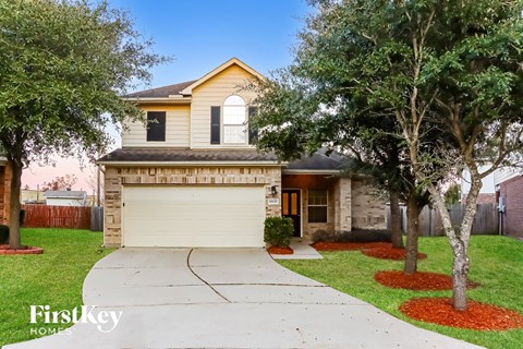 A house with a garage is for sale.