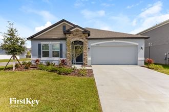 a house with a driveway and a garage door
