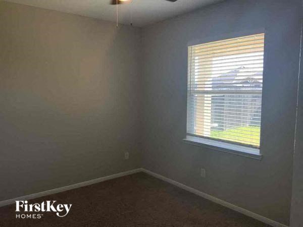 A room with a window and a FirstKey Homes logo.