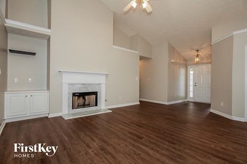 the living room and dining room with fireplace
