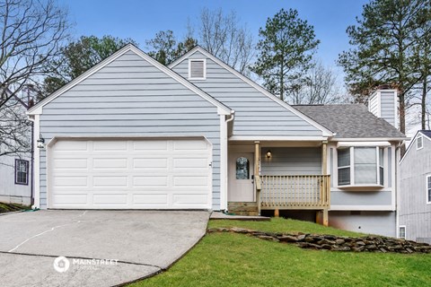 a white house with a white garage door