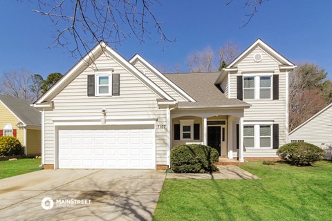 a white house with a white garage door