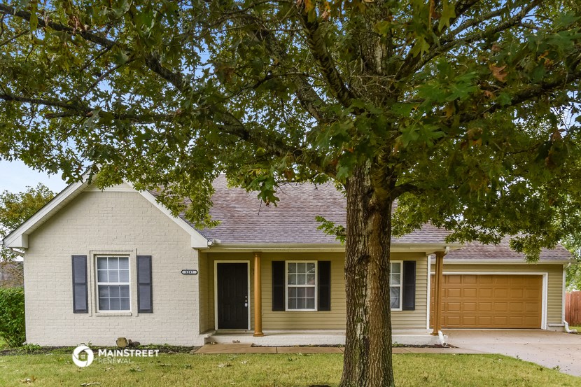 a house with a tree in front of it