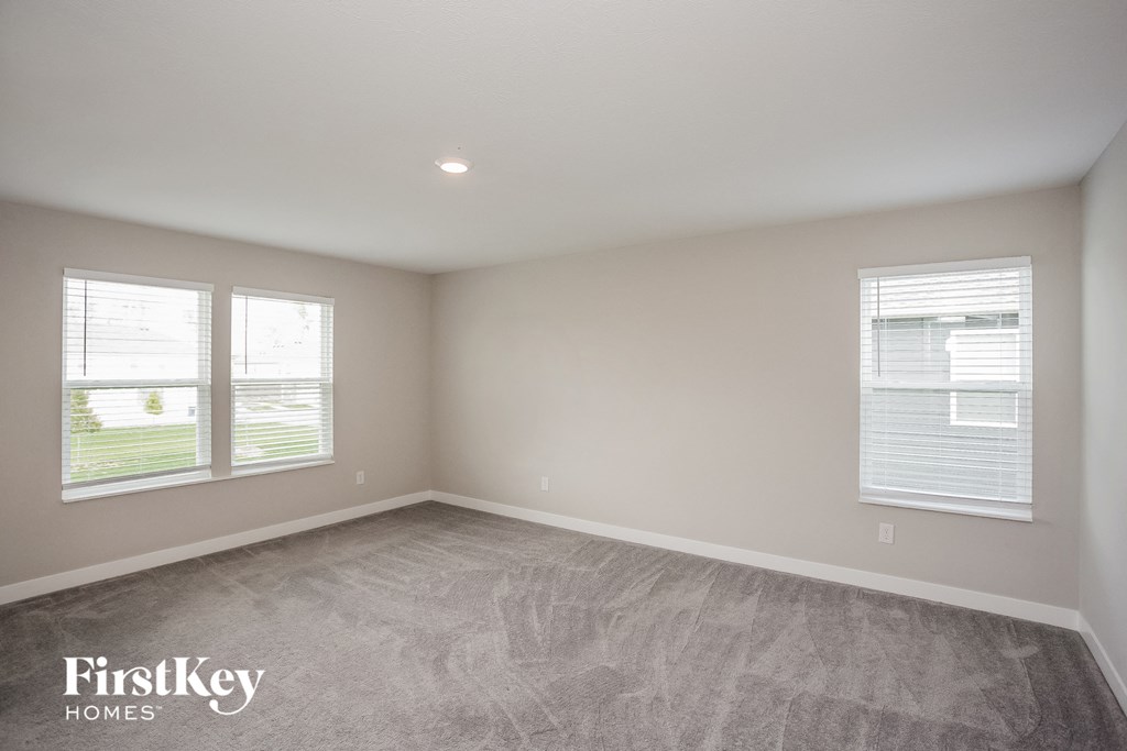 A room with a FirstKey Homes logo on the floor.