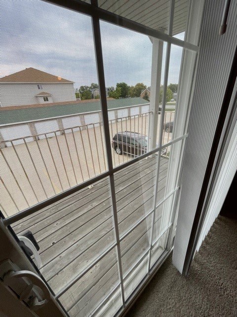 A view from inside a room looking out through a sliding glass door.
