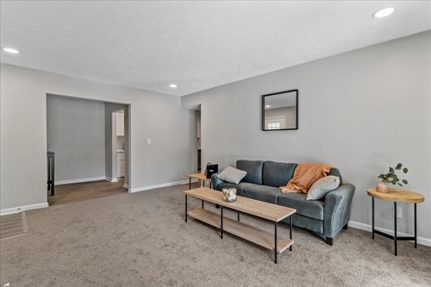 a living room with a couch and a coffee table