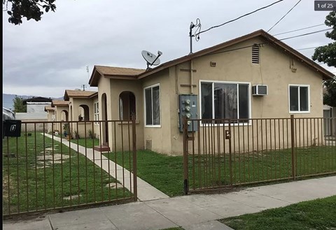 a row of houses with a fence
