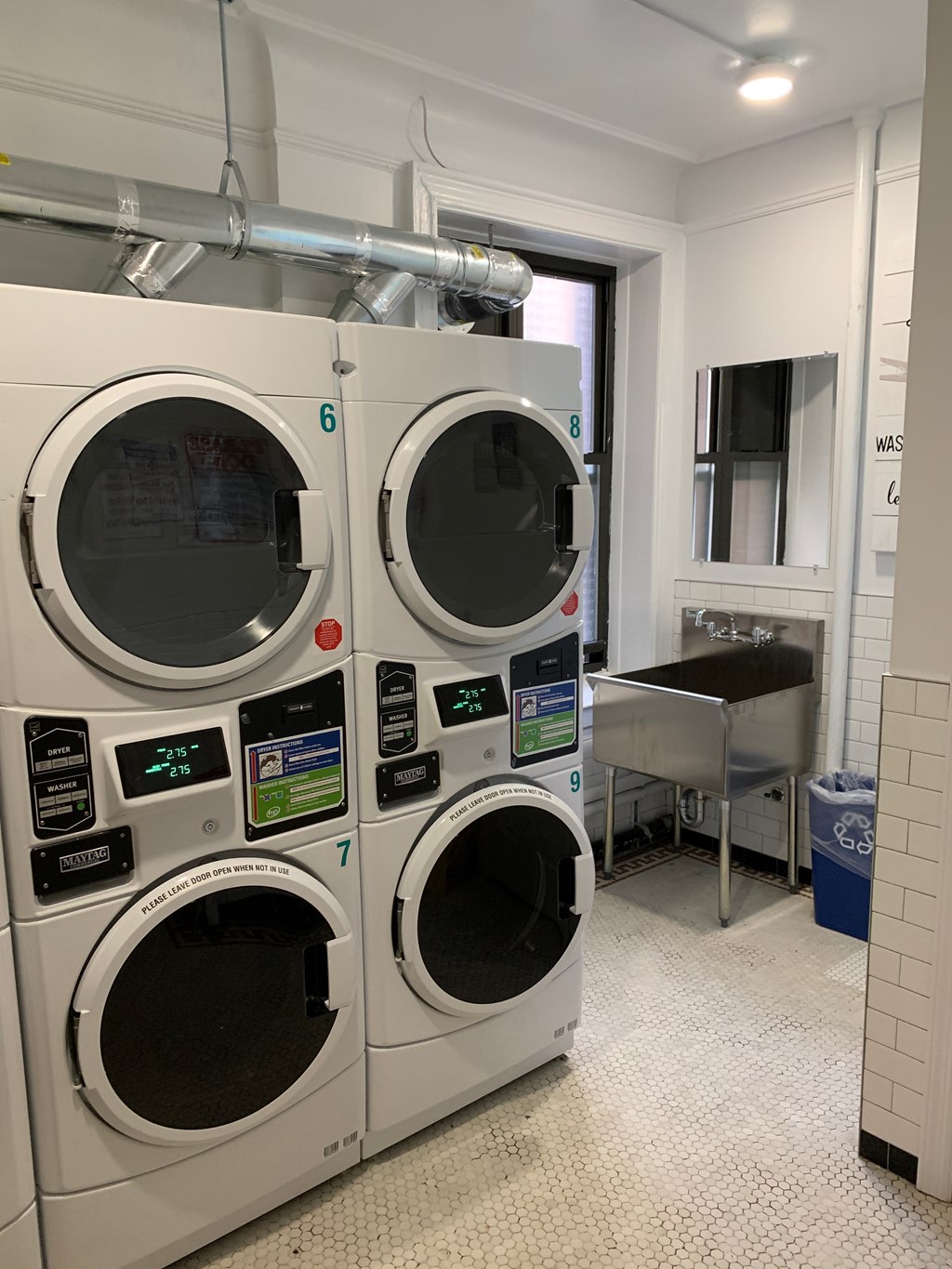 a washer and dryer machine in a laundry room