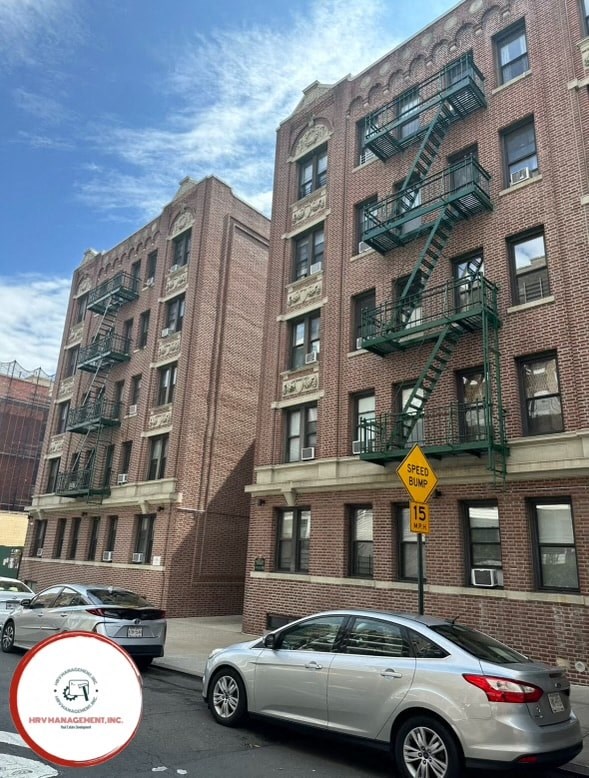 a car parked in front of a tall building
