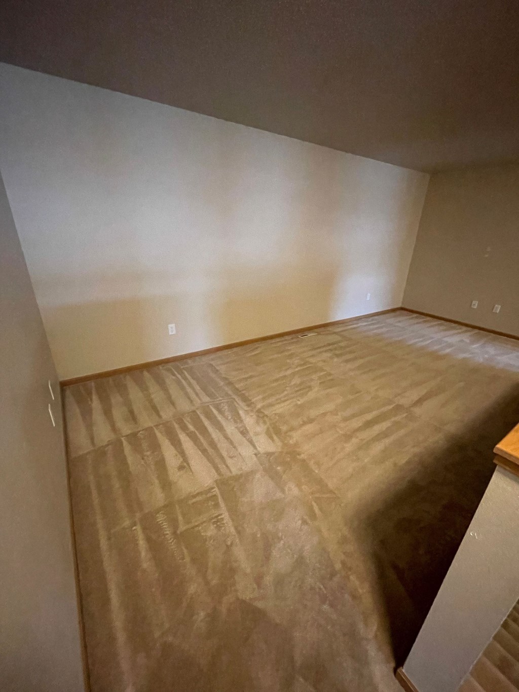 the living room is ready to be carpeted and remodeled