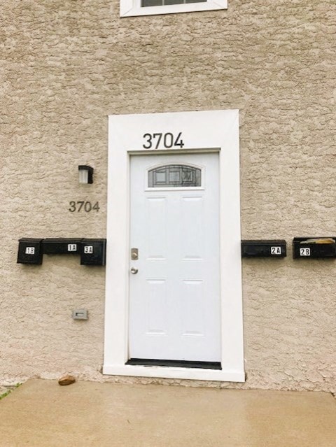 a white door on the side of a building