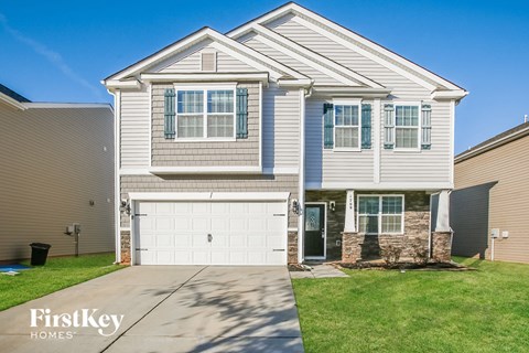 A two-story house with a garage is for sale by FirstKey Homes.