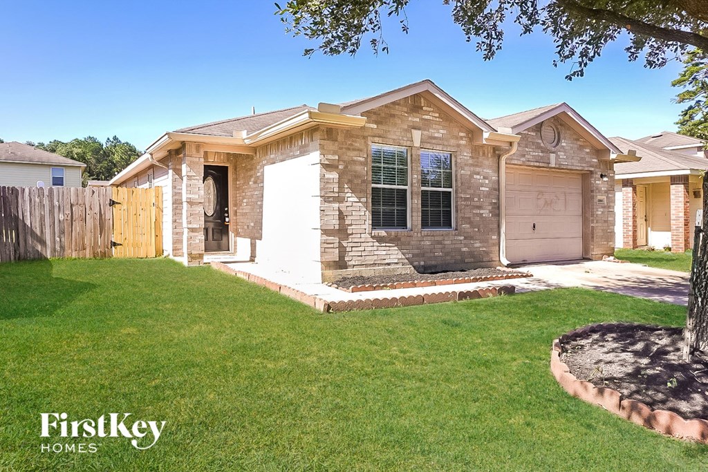 A house with a brown and white exterior is for sale by FirstKey Homes.