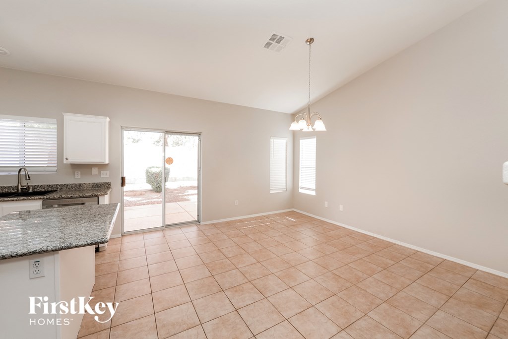 the living room and dining room are spacious and open to the patio