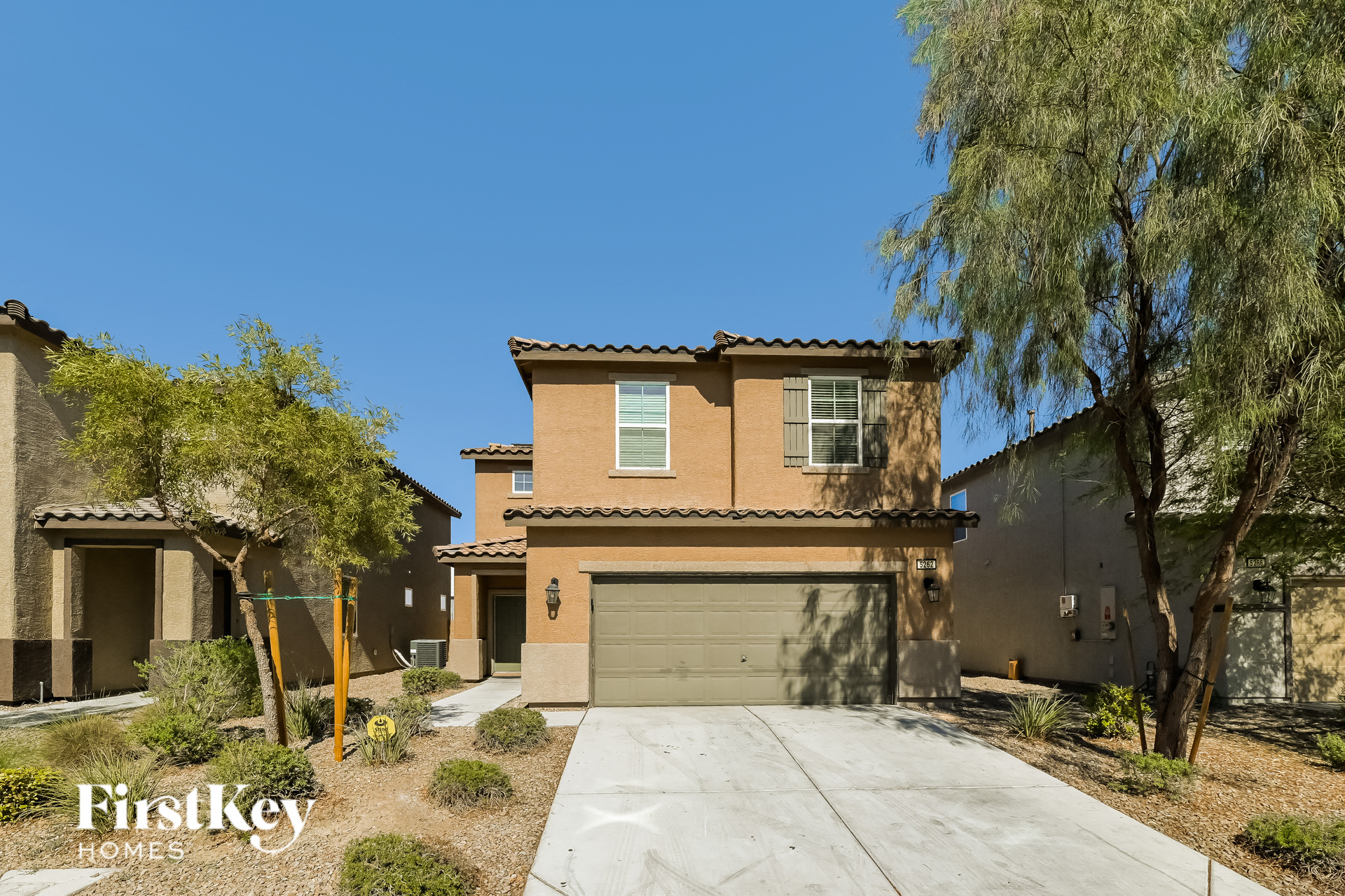 a house with a driveway and a garage door