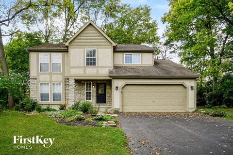a house with a driveway and a garage door