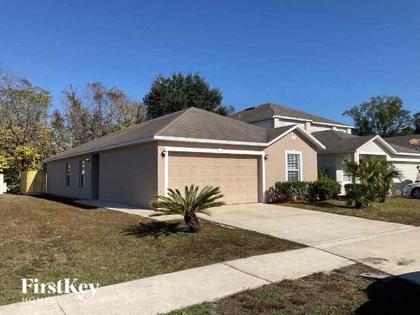 a house with a driveway and a garage door