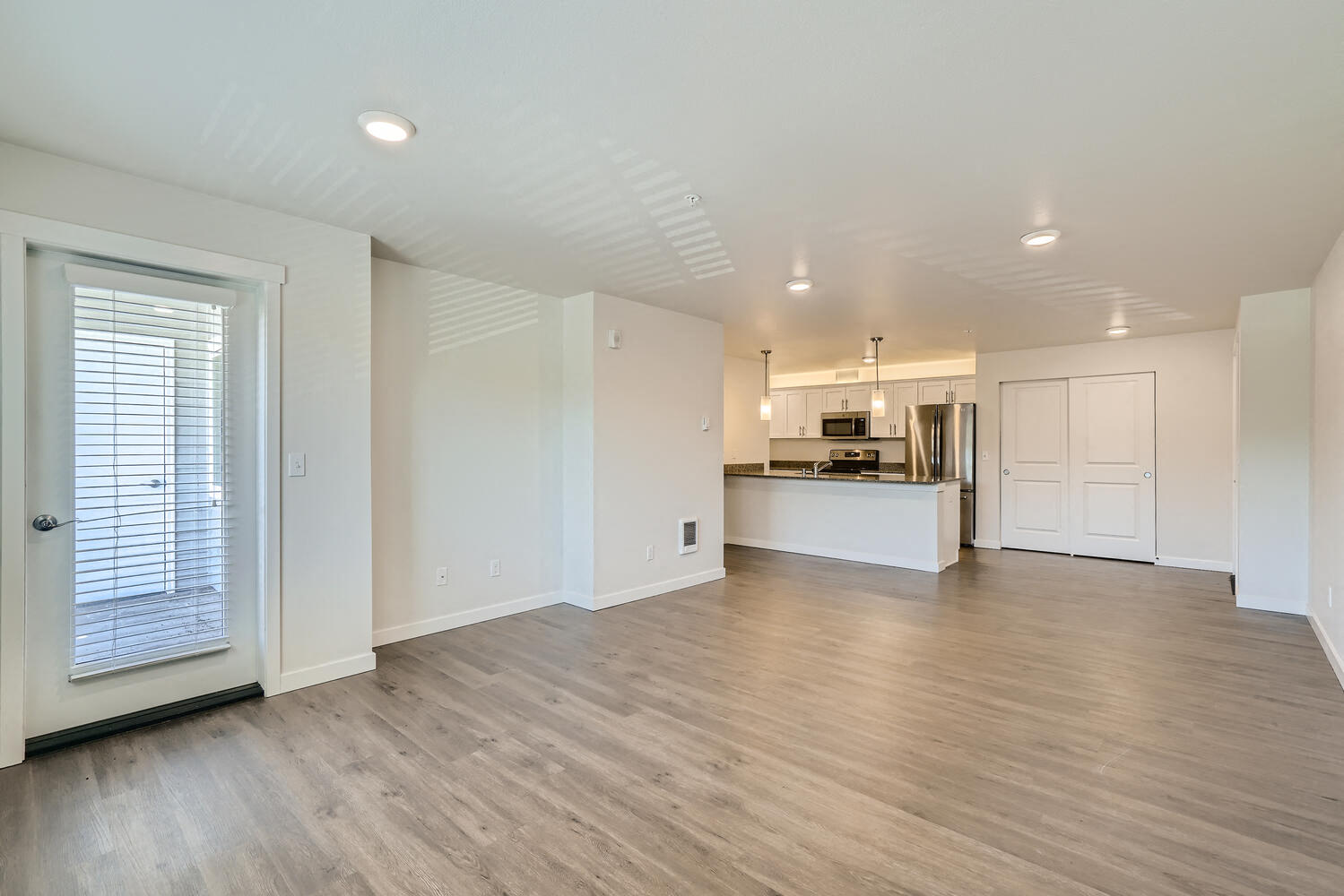 A Standard Living Room and Kitchen at Huntington Place Apartments