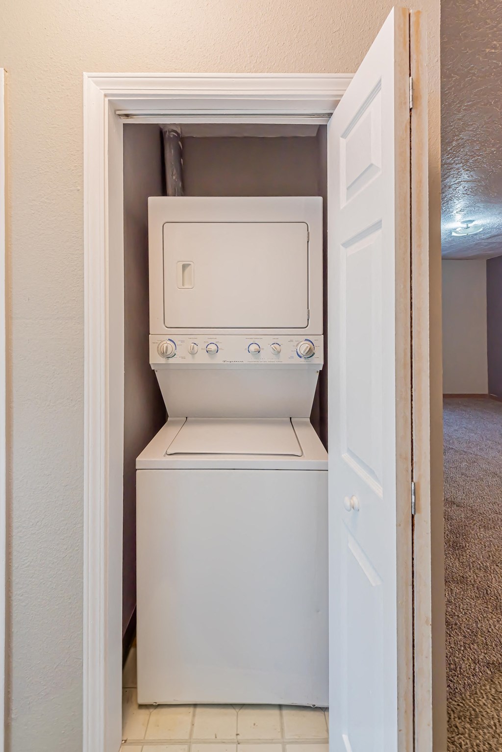 a laundry room with a washer and dryer in it