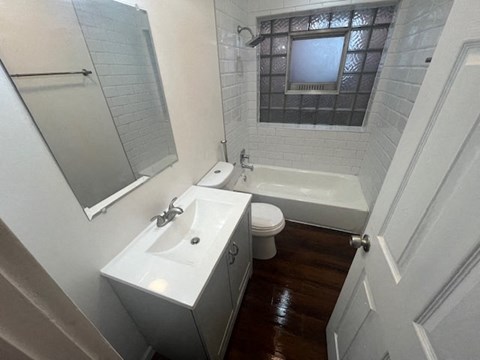 a bathroom with a sink toilet and a bath tub