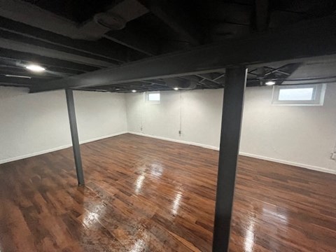 a living room with a hard wood floor and