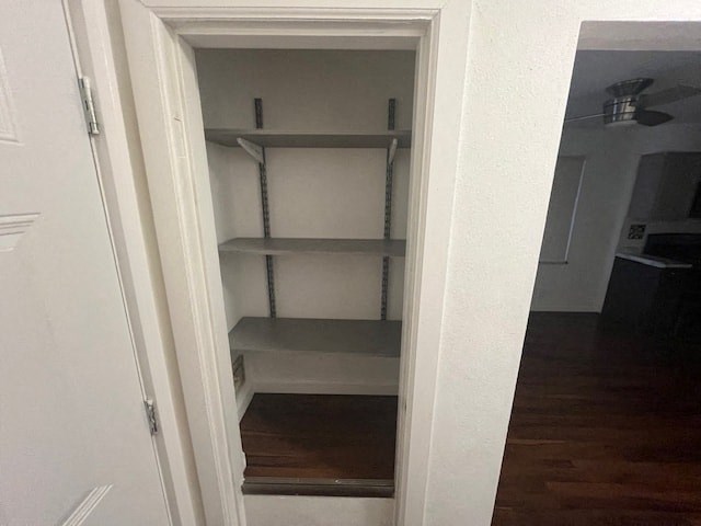 an empty shelf in a closet in a room