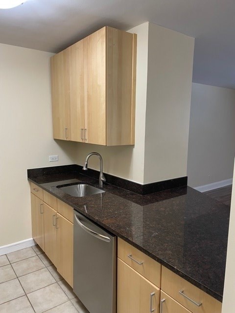 A kitchen with a sink and cabinets.