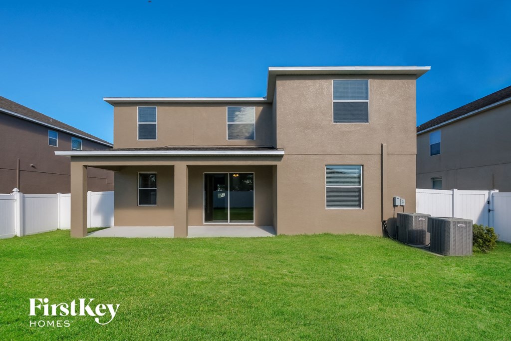 a house with a green lawn in front of it