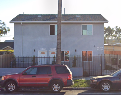 a house with cars parked in front of it