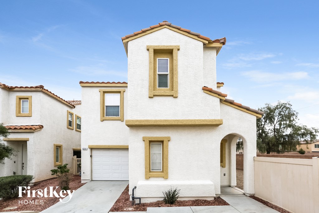 a white house with a white facade and a white garage door