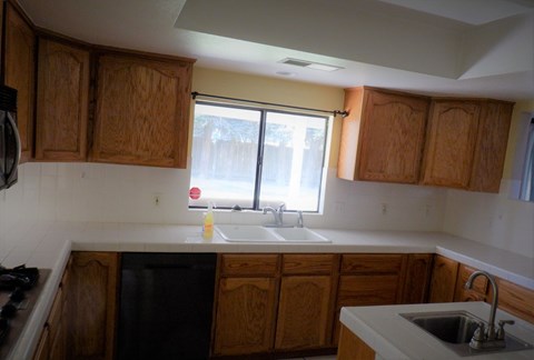 a kitchen with a sink and a window