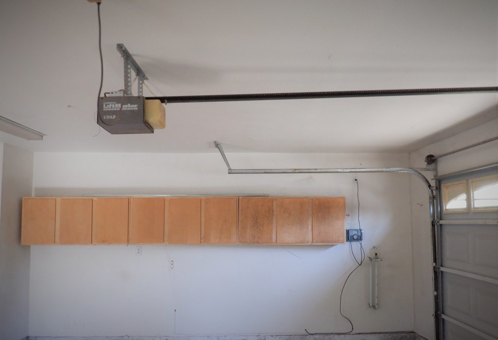 a view of the overhead cabinets in the living room of a house