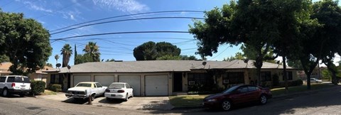 a house with three cars parked in front of it