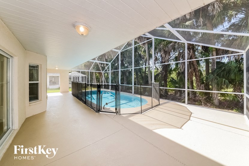 A pool in a house with FirstKey Homes written on the bottom left.