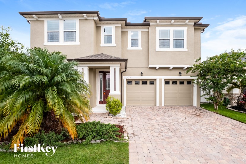 A house with a brown roof and a garage door.