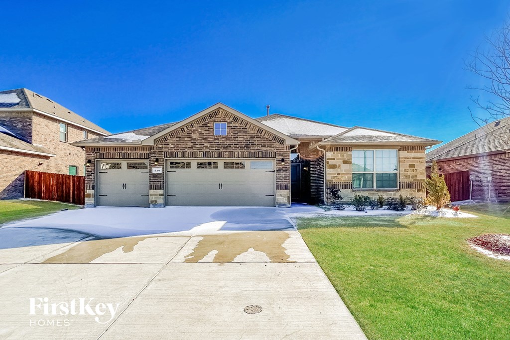 A large house with a driveway in front of it.