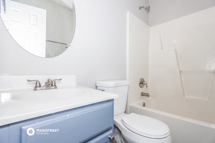a bathroom with a sink toilet and a shower