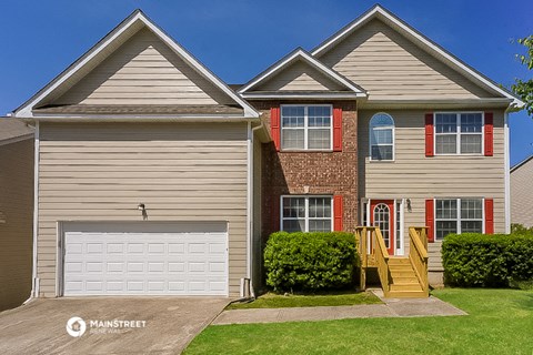 a house with a white garage door in front of it