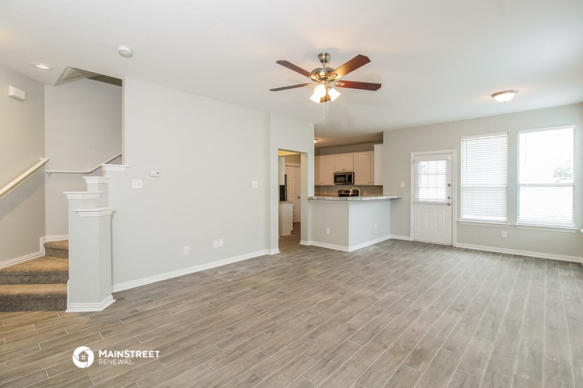 the living room is open to the kitchen and dining area