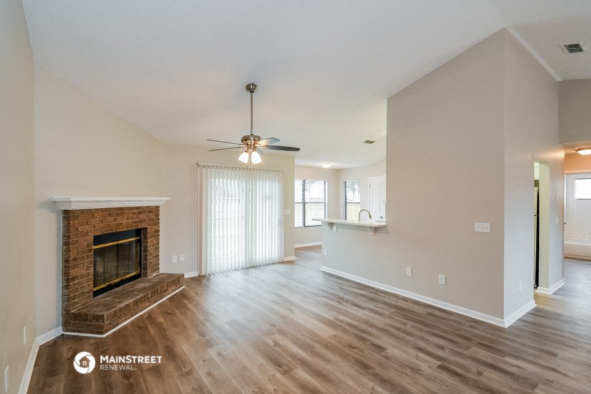 the living room and dining room with fireplace