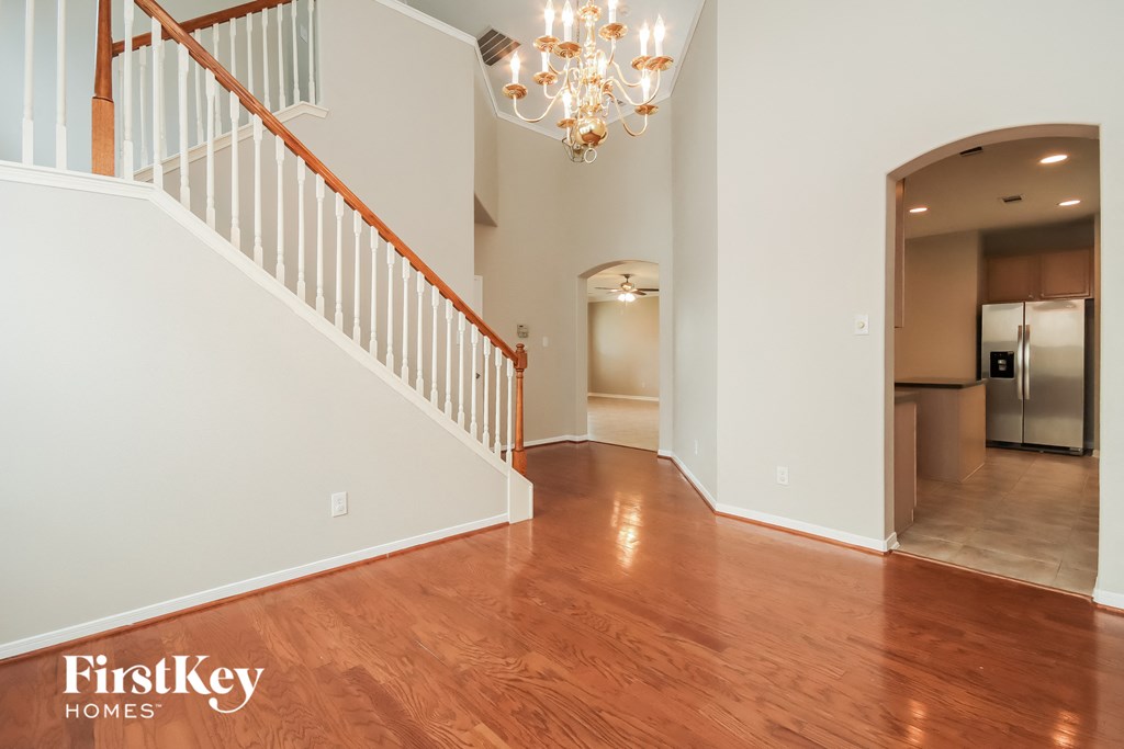 a view of the living room and dining room from the foyer