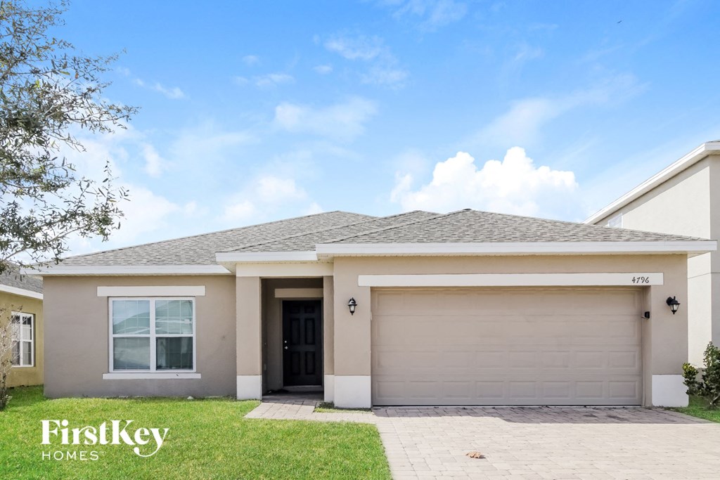 A house with a garage door that says 4756.